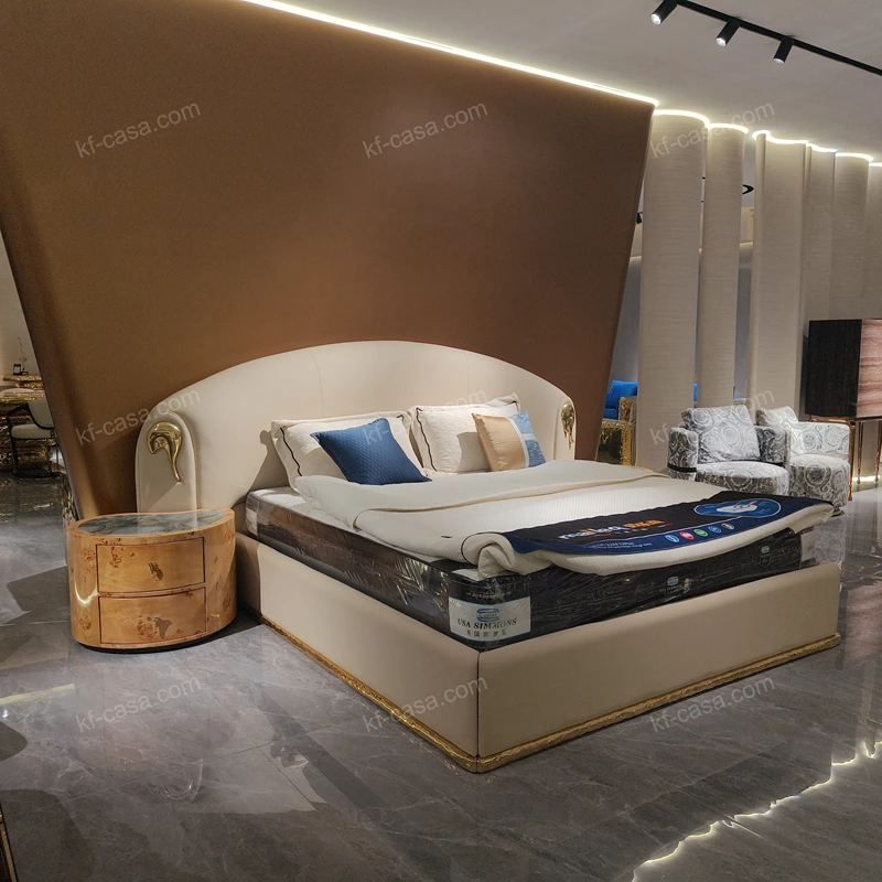 Beige Leather Upholstered Bed with Gold Stainless Steel Elephant Head Accents & Hammered Base Trim